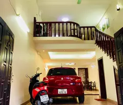 house for sale on ceiling level - 7-seater car entering the house