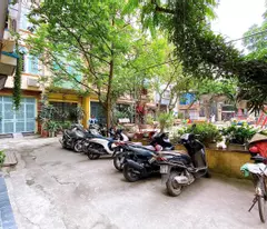 selling kuala lot house - around cars - flower garden view